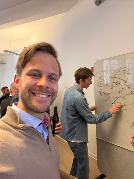 Jesper explaining the company structure with a classic whiteboard.